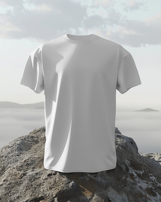 White t-shirt on a rock with a mountainous landscape in the background