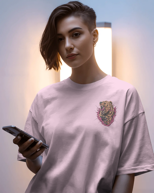 Person wearing a light gray t-shirt with a colorful tiger design, holding a phone.