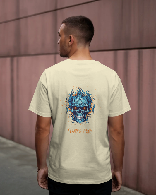 Man wearing a off-white t-shirt with a blue skull design on the back against a pink wall.