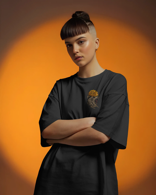 Person wearing a black outfit with a design on an orange background