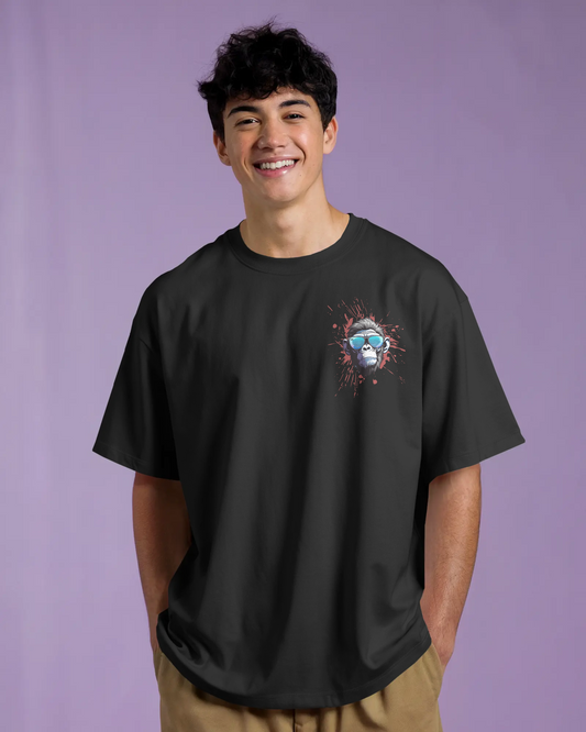 Young adult wearing a black oversized tshirt with a monkey graphic on it
