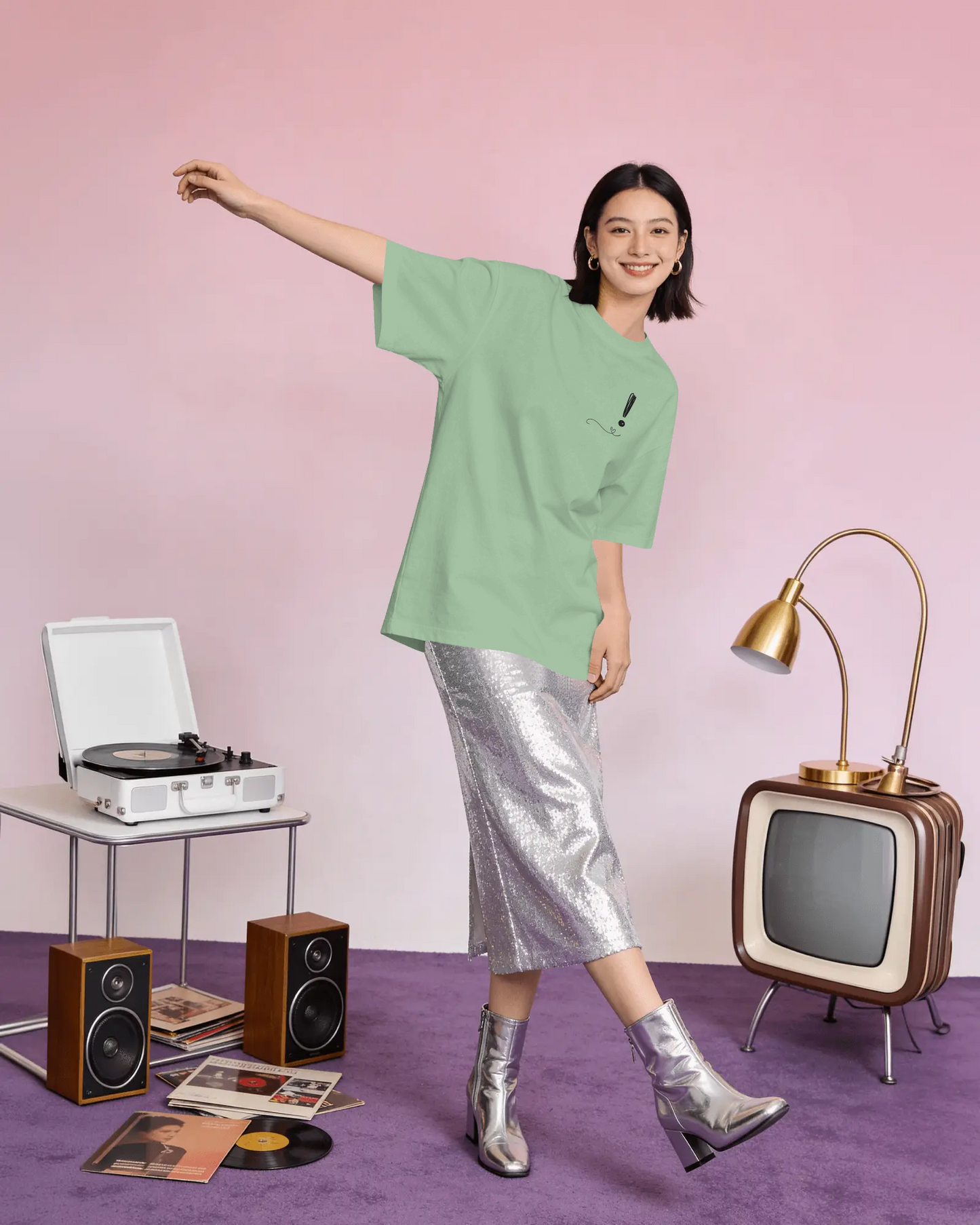 Woman in a green shirt and silver skirt posing in a room with vintage decor.
